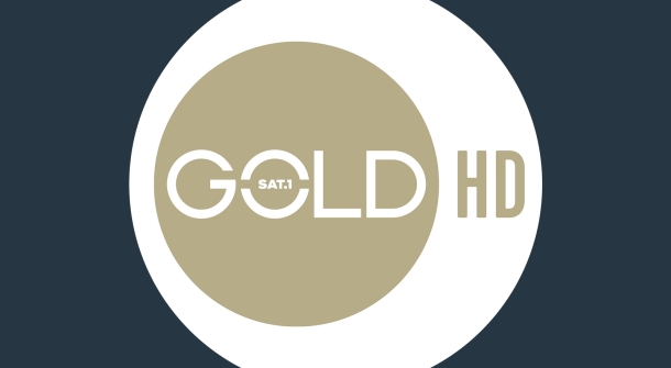 SAT1 Gold HD Logo - schwarzer Hintergrund mit weißem Kreis und in dem weißen Kreis nochmal goldener Kreis mit der Aufschrift &quot;SAT 1 Gold HD&quot;